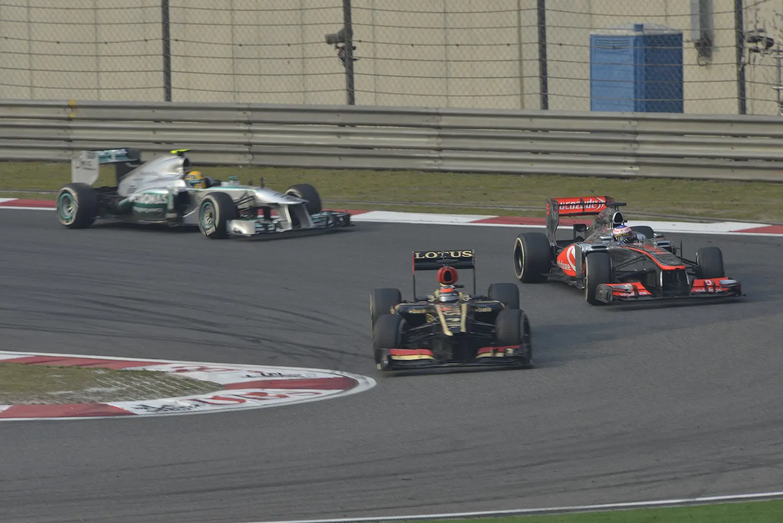 Formula 1 cars racing at the 2013 Chinese Grand Prix in Shanghai